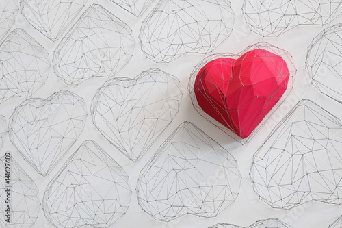 Naklejka na szybę Unique Red heart on white background among the many empty wireframe hearts. Abstract polygonal heart with shadow. Love symbol. Low-poly colorful style. 3d rendering