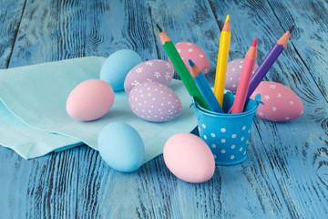 Wall Mural - Handmade festive easter eggs on blue background