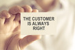 © stanciuc - Businessman holding THE CUSTOMER IS ALWAYS RIGHT message card