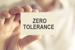 © stanciuc - Businessman holding ZERO TOLERANCE message card