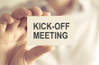 © stanciuc - Businessman holding KICK-OFF MEETING message card