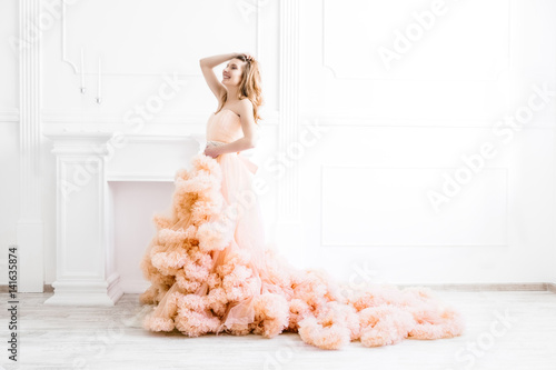 Dreamy Woman Portrait In A Long Pale Peach Color Ruffled