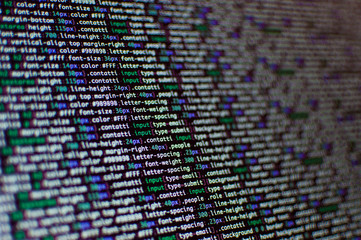 Wall Mural - software development. software source code. programming code. writing programming code on laptop.