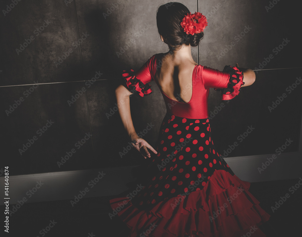 young hispanic flamenco dancer  while dancing - obrazy, fototapety, plakaty 