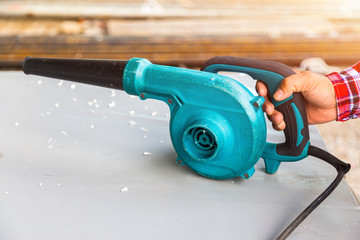 Man use blower tool in construction site.