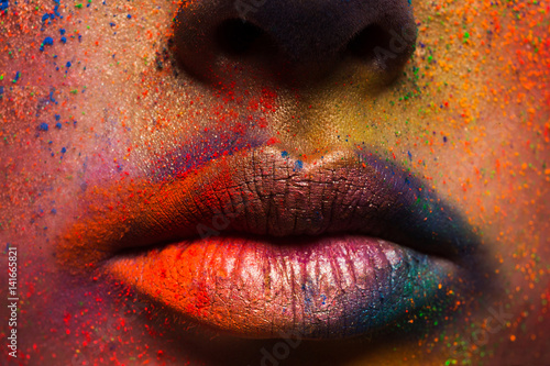 Lips of model with colorful art make-up, holi colors