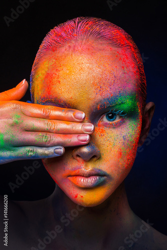 Model with colorful art make-up, close-up