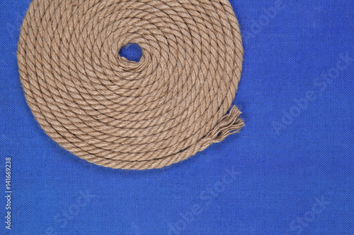Ship rope on blue background, top view with copy space Poster