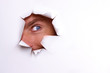 © OLGA - A curious eye looks into the torn hole on a white sheet