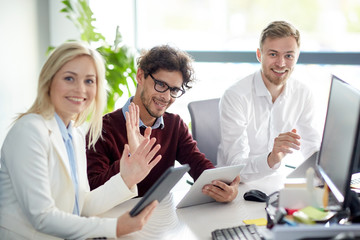 Wall Mural - happy business team with tablet pc at office