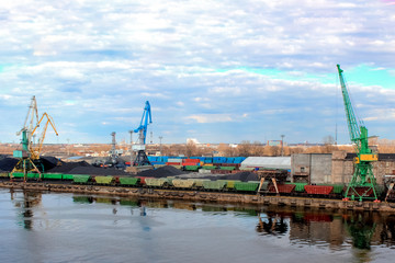 Wall Mural - Baltic coal terminal with port cranes near the river. Riga cargo