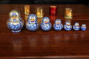 Traditional Russian dolls on wooden table