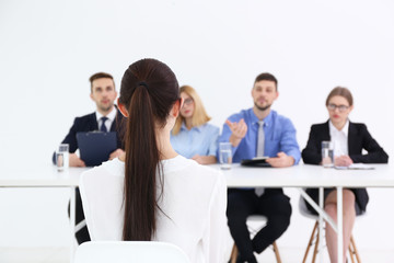 Wall Mural - Job interview concept. Human resources commission interviewing woman