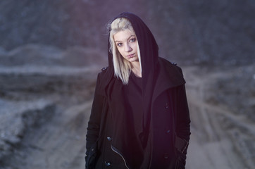 Young female wearing black hood