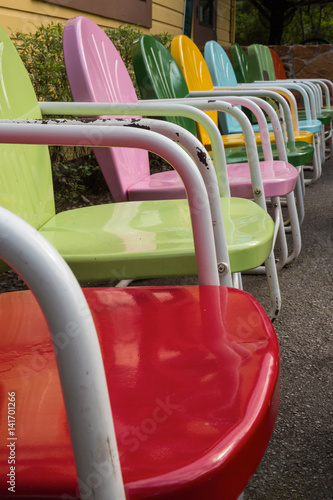Row Of Colorful Vintage Metal Lawn Chairs Buy This Stock Photo