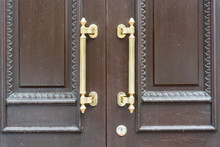 Closeup Metal Door Handle On Wooden Entrance Door