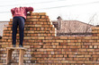 © schankz - Worker builds a brick wall in the house