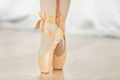 Legs of ballerina in ballet shoes, closeup