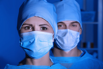 Canvas Print - Portrait of young surgeon with colleague in modern clinic