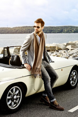 Wall Mural - Sports car dude in scarf, looking away