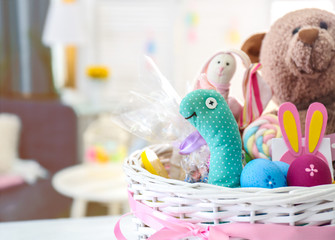 Canvas Print - Beautiful Easter basket with traditional colorful symbols and sweets, closeup