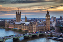 London, England - The Famous Big Ben With Houses Of Parliament And Westminster Bridge At Sunset