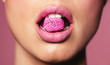 Leinwandbild Motiv Beautiful pink lips with a piece of candy