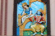 Wall art of Krishna tell Bhagavad gita to Arjuna in Mahabharata war as in Hindu epic in temple
