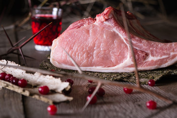 Wall Mural - Fresh game meat on a wooden table