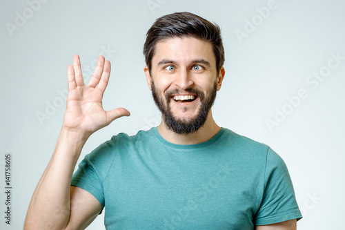 Cuadros en Lienzo Man making Vulcan salute isolated