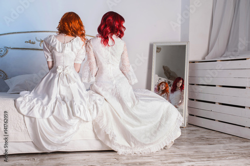 Two Beautiful Girls With Red Hair In A Beautiful White