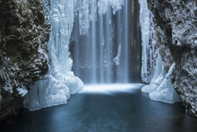 Italy, Trentino South Tyrol, Non Valley, Waterfall From Smeraldo Lake In Winter.