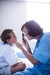 © WavebreakMediaMicro - Female doctor examining patient with ophthalmic device