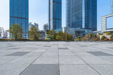 Canvas Print - empty brick floor with cityscape and skyline