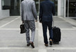 © Rawpixel.com - Business Men Walk Talk Luggage