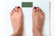 © michaelheim - Woman feet on weight scales