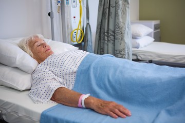 Senior patient lying on bed