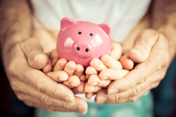 Family holding piggybank in hands