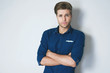© Nik Stock Studio - Why so serious? Bossy young attractive man crossing arms, manager, office style studio shot  against grey background