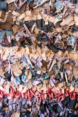 Old fashioned traditional oriental carpet with rags, as background