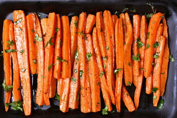 Wall Mural - Grilled carrots with green herbs