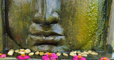 Wall Mural - Buddha face statue with traditional asian decoration in ancient culture temple in Asia