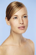 © sanneberg - Blue eyed beautiful woman against blue background