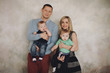 © tatyana_k - Happy family portrair. Parents with baby two boys  twins.Portrait of happy family with two children smiling at camera.