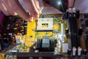 A mainboard ( Main board,cpu motherboard,logic board,system board or mobo board)
close up of electronics circuit board 
