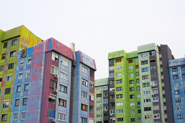 Wall Mural - Colorful block of flats in Slovenian city - old and ugly architecture and residential building. Housing project was made in style of brutalism in era of socialist Yugoslavia