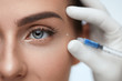 Closeup oF Beautiful Woman Face Getting Skin Lift Injection