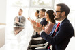 © BGStock72 - Smiling business group clapping hands at the meeting