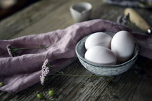 Close-up Of Eggs In Bowl On Wooden Table