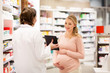 © Syda Productions - pregnant woman and druggist at pharmacy
